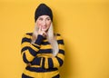 Smiling thoughts young woman thinking. Close up portrait of inspired girl with smile face expression, model wearing woolen cap and Royalty Free Stock Photo