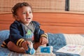 Smiling toddler having fun with a book