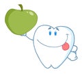 Smiling tooth holding up a green apple