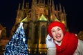 Smiling tourist woman in Christmas Prague speaking on smartphone Royalty Free Stock Photo
