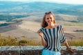 Smiling tourist woman with retro photo camera in Tuscany Royalty Free Stock Photo