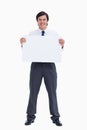 Smiling tradesman holding blank sign