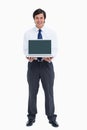 Smiling tradesman presenting screen of his laptop