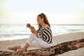 Solo traveller woman viewing photos on camera