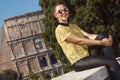 Trendy tourist woman in yellow blouse in Rome, Italy