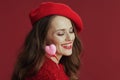 smiling trendy woman in red sweater and beret Royalty Free Stock Photo