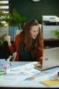 Smiling business owner woman working with documents rejoicing Royalty Free Stock Photo