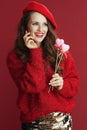 smiling trendy 40 years old woman in red sweater and beret Royalty Free Stock Photo