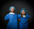 Smiling twin children doctors