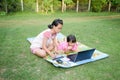 Smiling two sister using laptop outdoor Royalty Free Stock Photo