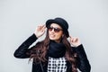 Smiling urban girl with smile on her face. Portrait of fashionable gir wearing a rock black style having fun outdoors Royalty Free Stock Photo