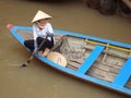 Smiling Vietnamese woman tourism boat - Vietnam