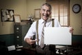 Smiling vintage businessman holding a blank sign Royalty Free Stock Photo
