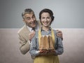 Smiling vintage couple with cake