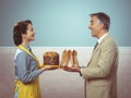 Smiling vintage couple with cakes