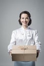 Smiling vintage woman with mail package Royalty Free Stock Photo