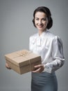 Smiling vintage woman with mail package Royalty Free Stock Photo