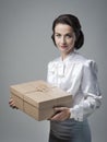 Smiling vintage woman with mail package Royalty Free Stock Photo