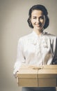 Smiling vintage woman with mail package Royalty Free Stock Photo