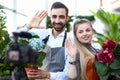 Smiling Vlogger Recording Hydrangea in Flowerpot