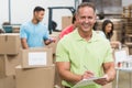 Smiling volunteer man taking notes holding clipboard Royalty Free Stock Photo