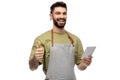 Smiling waiter in apron taking notes to notepad Royalty Free Stock Photo