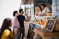 Smiling waiter taking order from couple Royalty Free Stock Photo