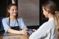 Woman client paying on terminal with card nfc technology method Royalty Free Stock Photo