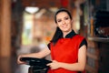 Smiling Waitress Holding Tray in a Restaurant Royalty Free Stock Photo