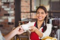 Smiling waitress serving a client