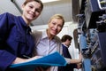 smiling warehouse managers looking at camera Royalty Free Stock Photo