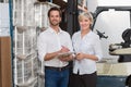 Smiling warehouse managers looking at camera Royalty Free Stock Photo