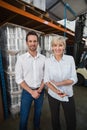 Smiling warehouse managers looking at camera Royalty Free Stock Photo