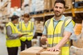 Smiling warehouse workers preparing a shipment Royalty Free Stock Photo