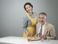 Smiling wife serving dinner Royalty Free Stock Photo