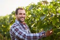 Smiling winemaker in the vineyard