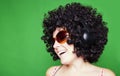 Smiling woman with afro hair listen to music with headphones Royalty Free Stock Photo