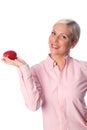 Smiling woman with an apple Royalty Free Stock Photo