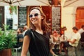 Smiling Woman on the Background of European Old Town Street. Ljubljana, Slovenia Royalty Free Stock Photo