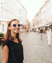 Smiling Woman on the Background of European Old Town Street. Ljubljana, Slovenia Royalty Free Stock Photo