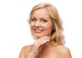 Smiling woman with bare shoulders touching face Royalty Free Stock Photo