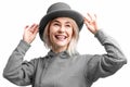 Smiling woman. Beautifu youngl woman wearing gray hat and in a gray sweatshirt Royalty Free Stock Photo