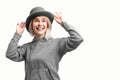 Smiling woman. Beautifu youngl woman wearing gray hat and in a gray sweatshirt Royalty Free Stock Photo