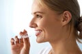 Smiling Woman With Beautiful Smile Using Invisible Teeth Trainer