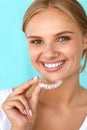 Smiling Woman With Beautiful Smile Using Teeth Whitening Tray