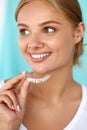 Smiling Woman With Beautiful Smile Using Teeth Whitening Tray Royalty Free Stock Photo