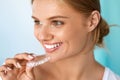Smiling Woman With Beautiful Smile Using Teeth Whitening Tray Royalty Free Stock Photo