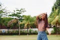 smiling woman beautiful summer walk park t-shirt lifestyle bag freedom nature Royalty Free Stock Photo