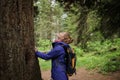 Smiling woman by the big cedar tree