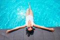 Smiling woman in big sunglasess relax in swiming pool on luxury Royalty Free Stock Photo